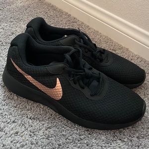 Blk and rose gold Nike Tanjun